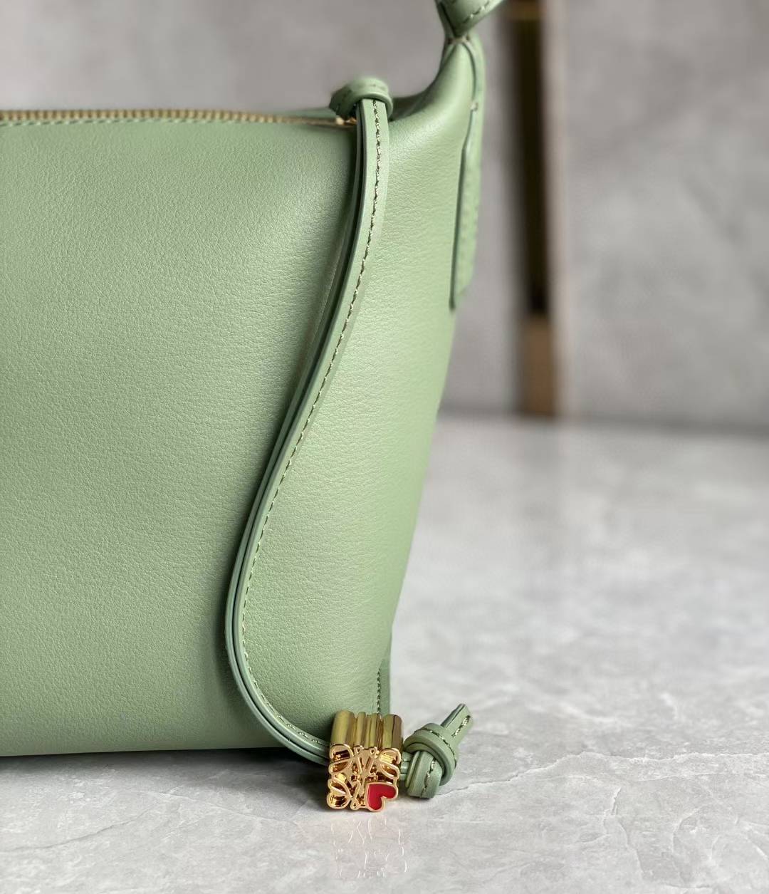 Loewe Small Cubi leather shoulder bag in green.