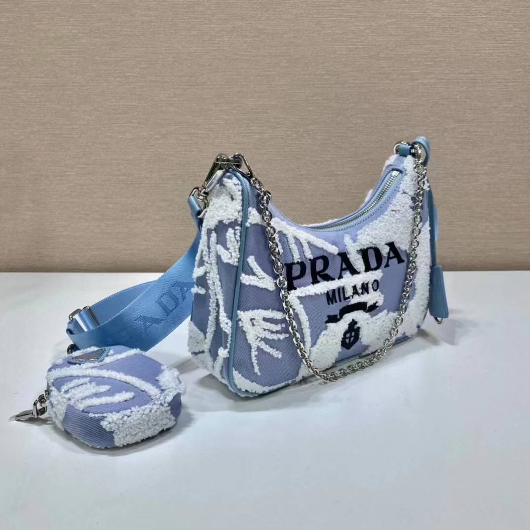 Prada Re-Edition 2005 shoulder bag in blue with white embroidery