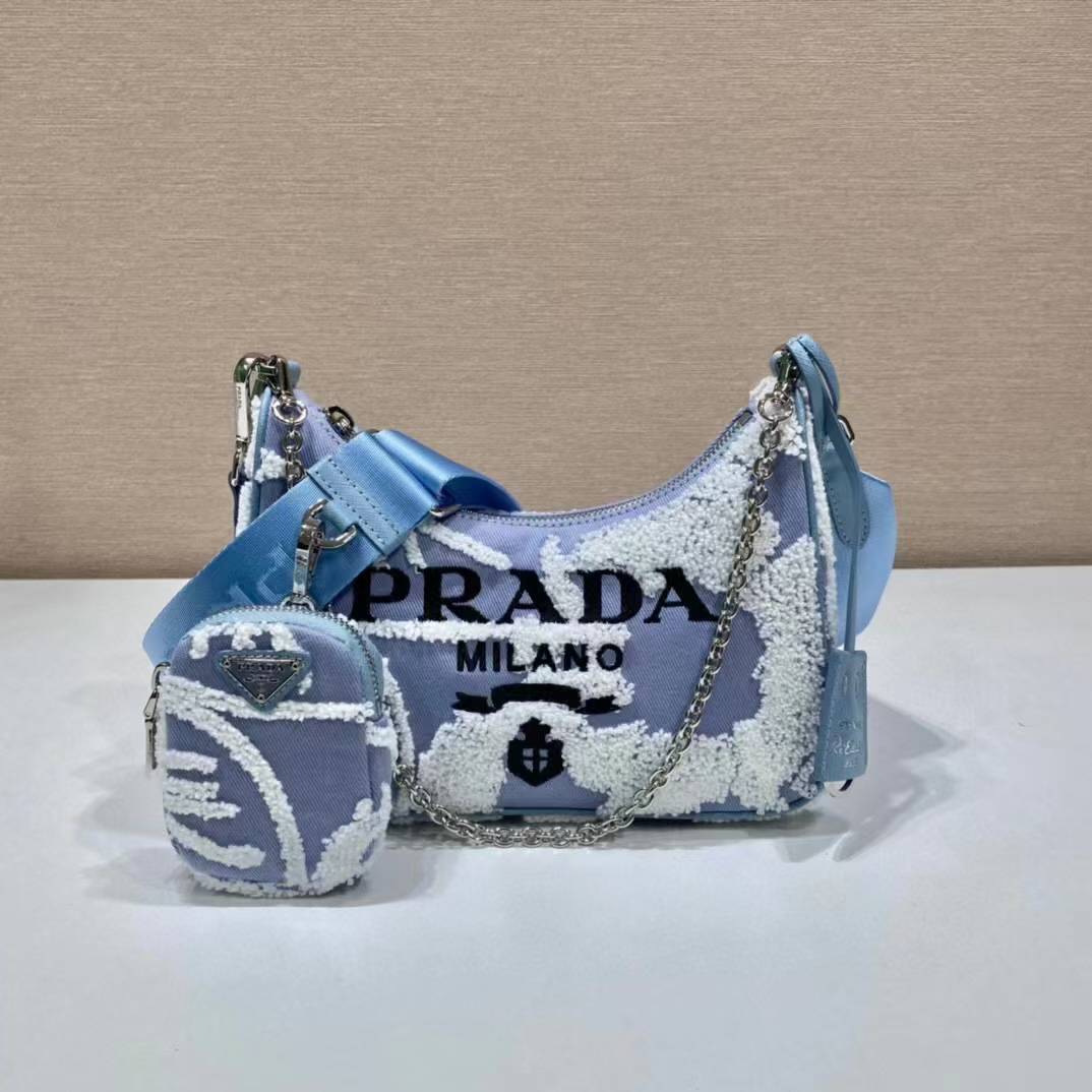 Prada Re-Edition 2005 shoulder bag in blue with white embroidery