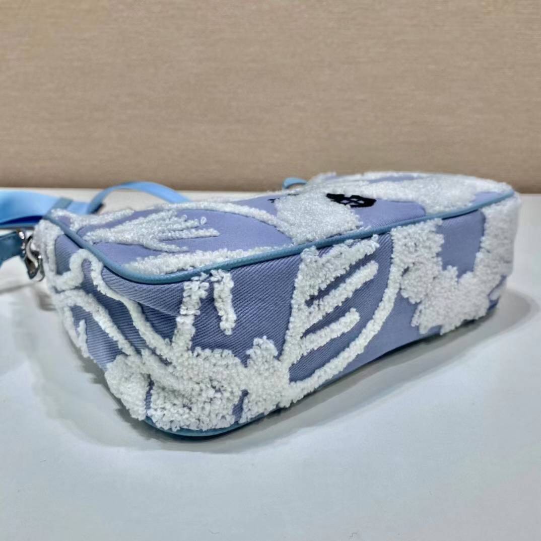 Prada Re-Edition 2005 shoulder bag in blue with white embroidery