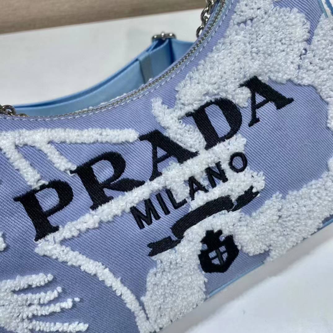 Prada Re-Edition 2005 shoulder bag in blue with white embroidery