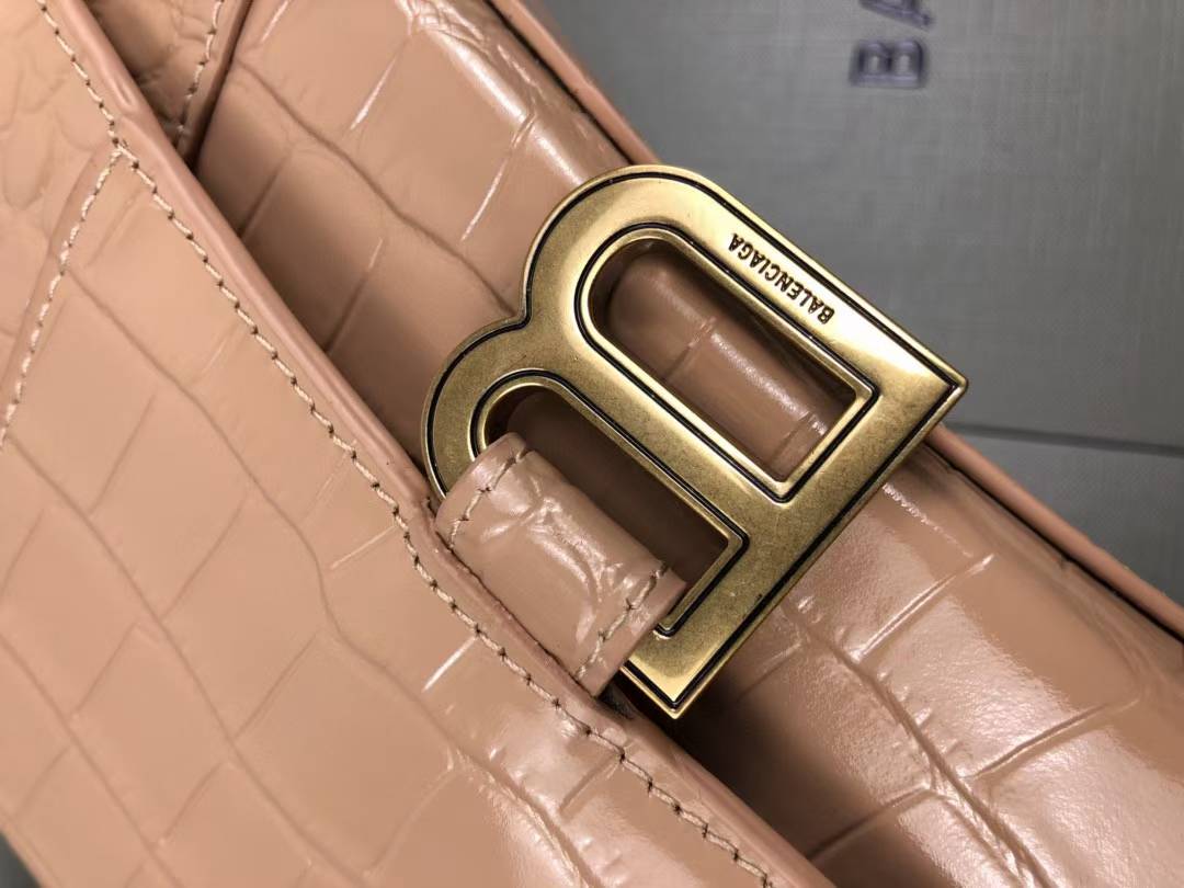 Balenciaga Hourglass handbag likely the Small or XS model, crafted from beige crocodile-embossed leather and featuring the signature B logo plaque