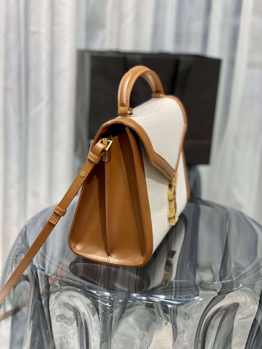 Saint Laurent Cassandra Top Handle Bag, likely in a mini or medium size, featuring a linen and leather construction with gold-toned hardware