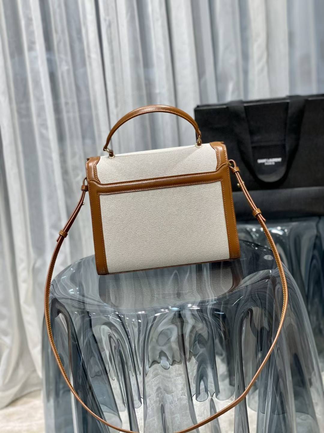 Saint Laurent Cassandra Top Handle Bag, likely in a mini or medium size, featuring a linen and leather construction with gold-toned hardware