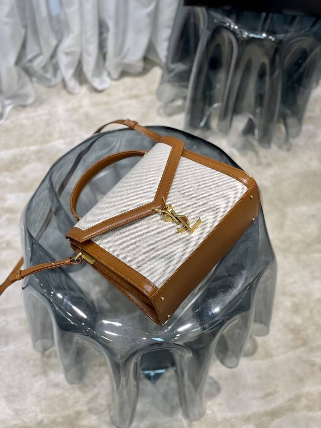 Saint Laurent Cassandra Top Handle Bag, likely in a mini or medium size, featuring a linen and leather construction with gold-toned hardware