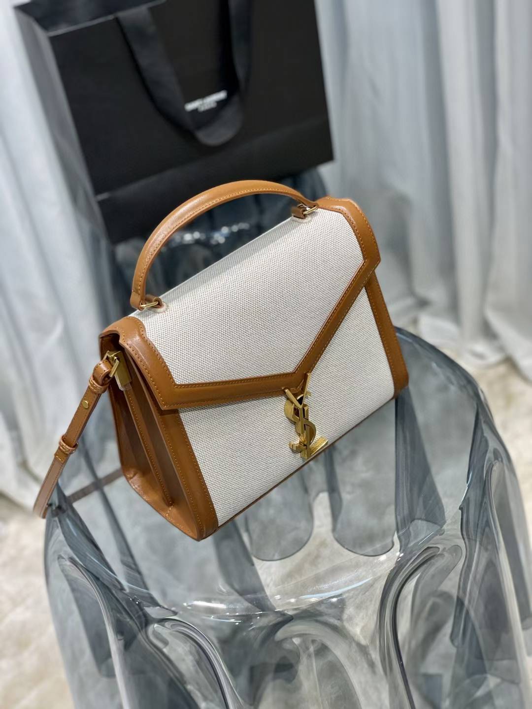 Saint Laurent Cassandra Top Handle Bag, likely in a mini or medium size, featuring a linen and leather construction with gold-toned hardware