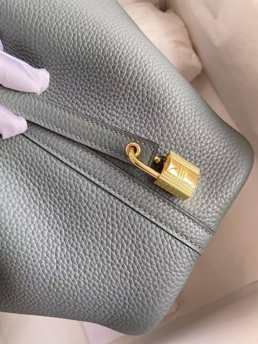 Hermès Picotin Lock 18 bag in a green shade, likely Vert Mangrove or Gris Meyer, featuring Clemence leather and gold hardware