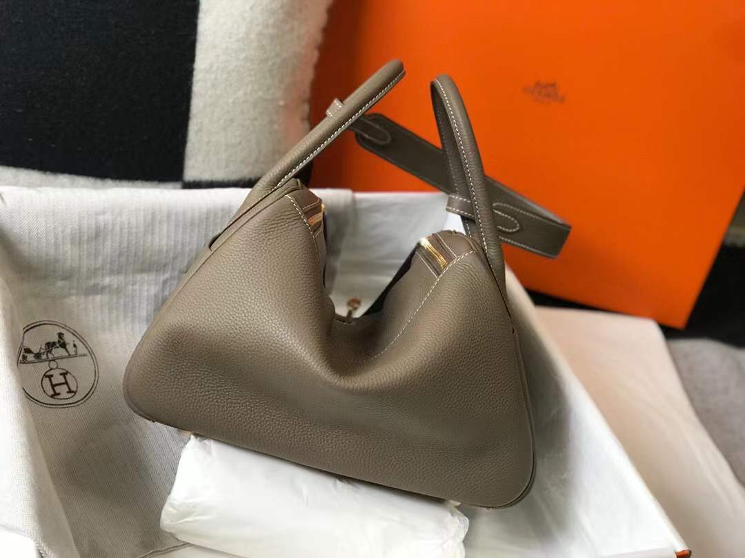 Hermès Lindy bag in Etoupe color with gold hardware.