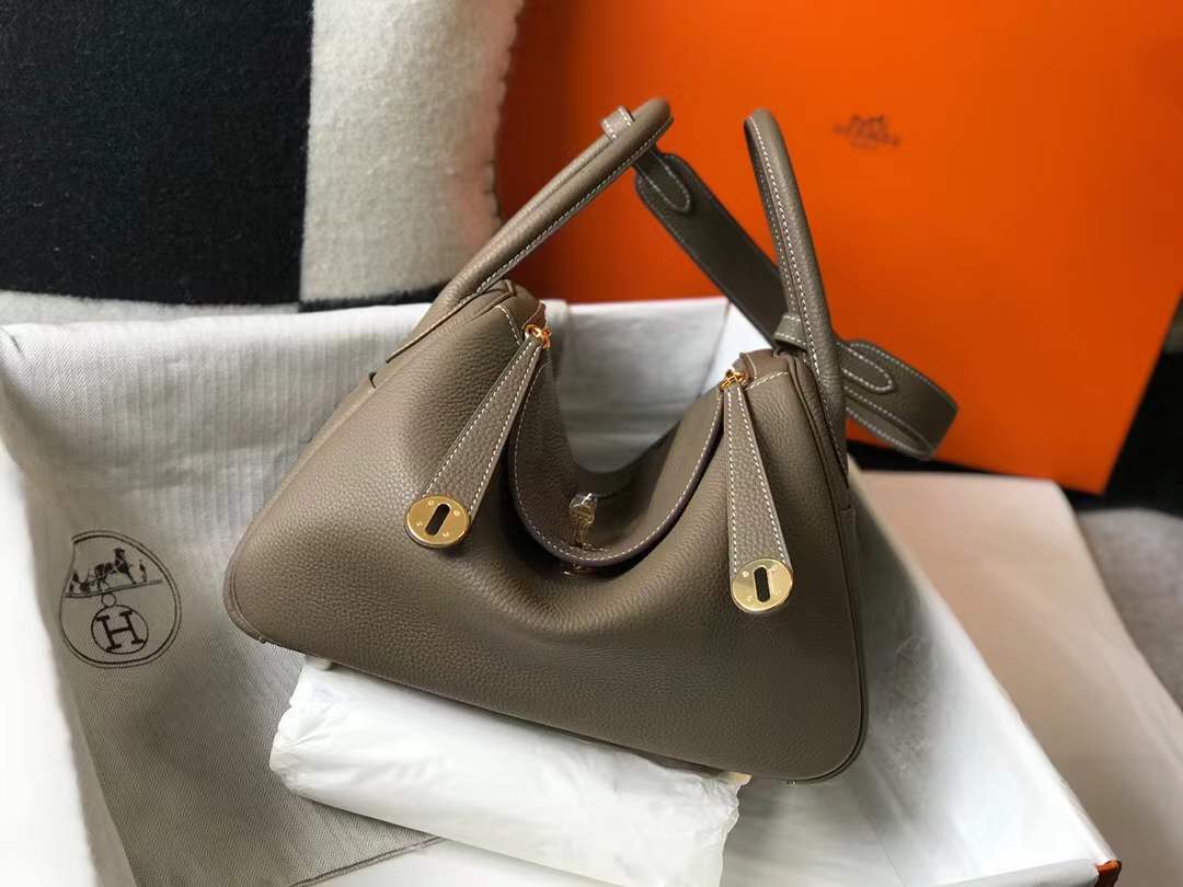 Hermès Lindy bag in Etoupe color with gold hardware.