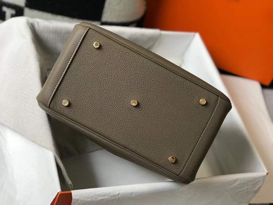 Hermès Lindy bag in Etoupe color with gold hardware.