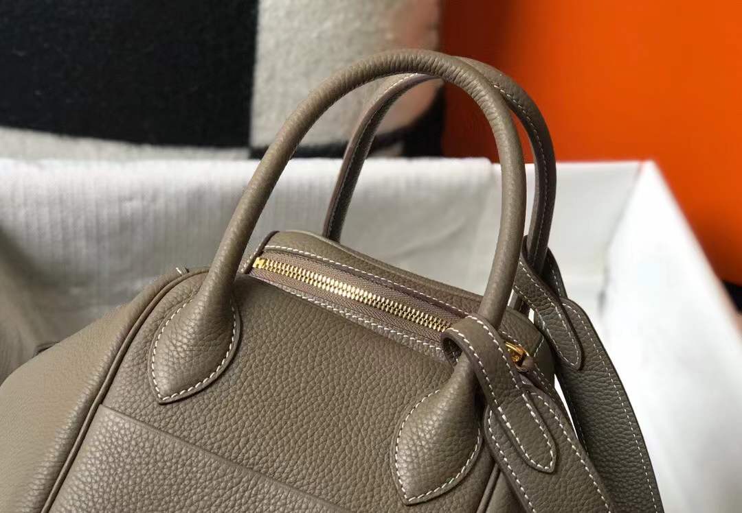 Hermès Lindy bag in Etoupe color with gold hardware.