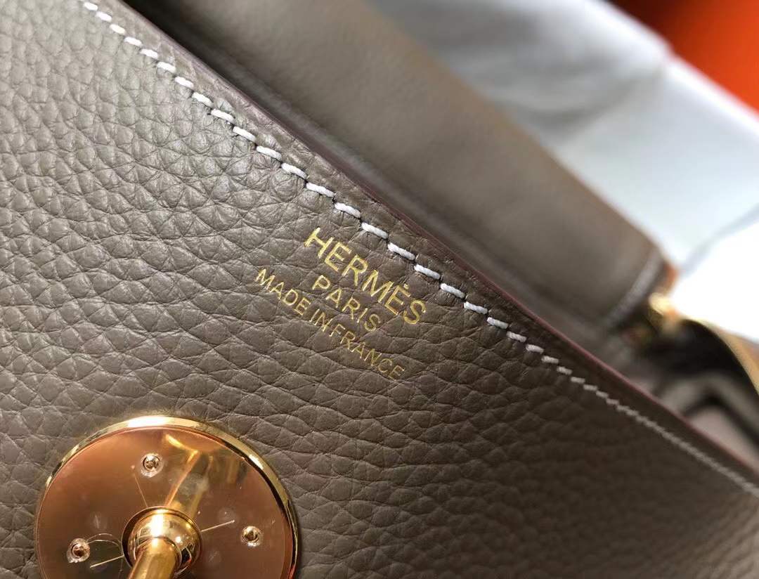 Hermès Lindy bag in Etoupe color with gold hardware.