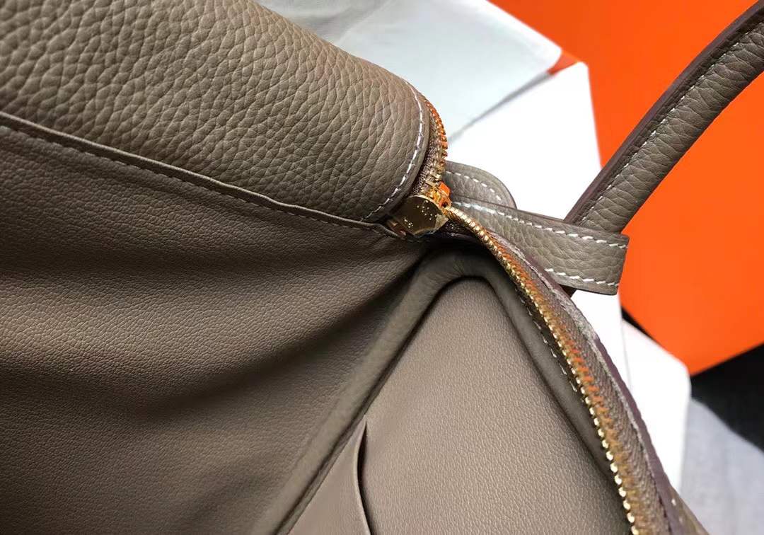 Hermès Lindy bag in Etoupe color with gold hardware.