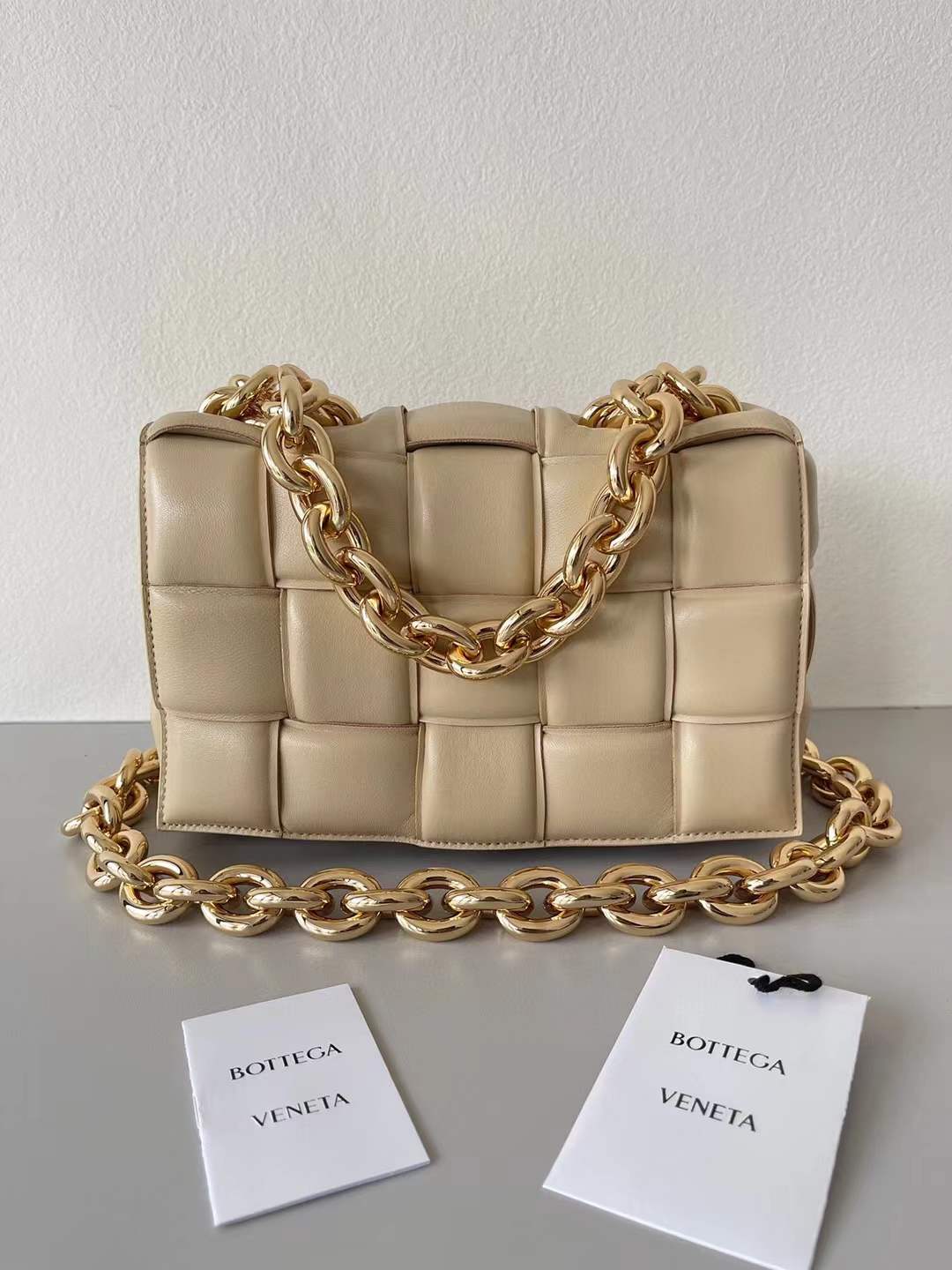 Bottega Veneta Chain Cassette Shoulder Bag in a beige leather with a padded weave and gold chain