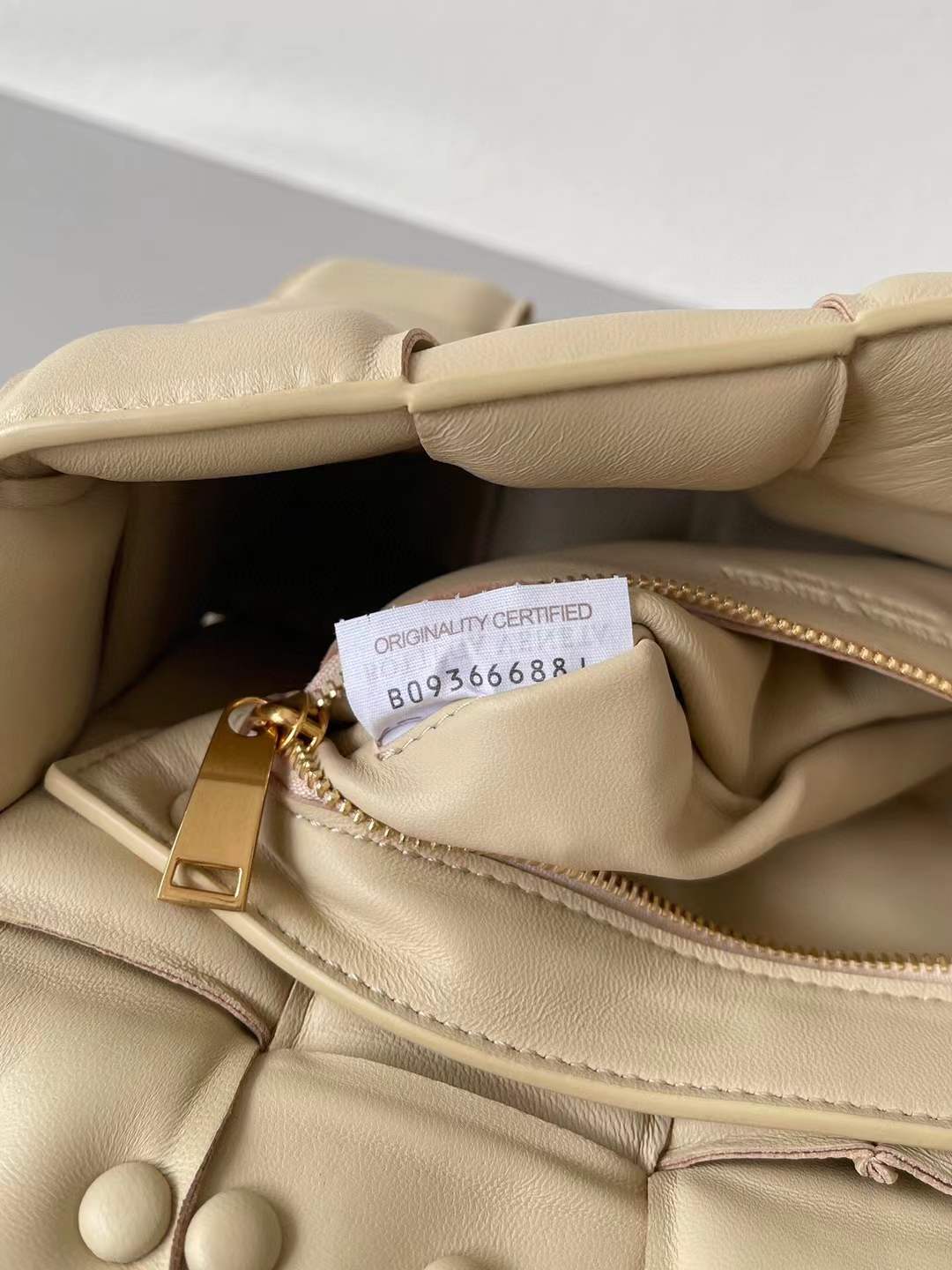 Bottega Veneta Chain Cassette Shoulder Bag in a beige leather with a padded weave and gold chain