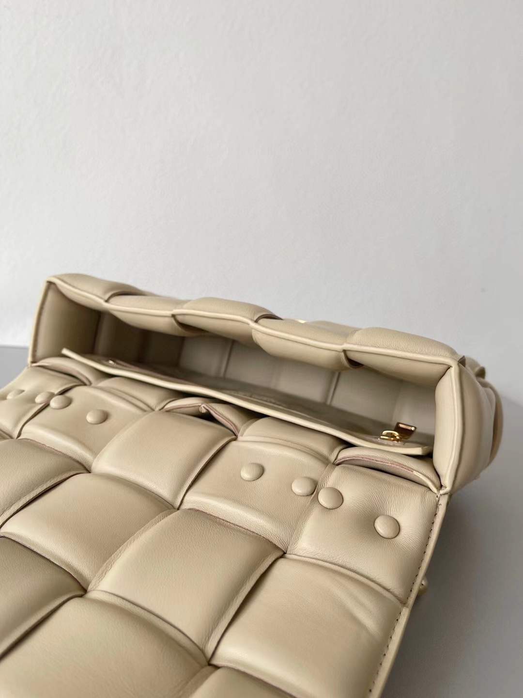 Bottega Veneta Chain Cassette Shoulder Bag in a beige leather with a padded weave and gold chain