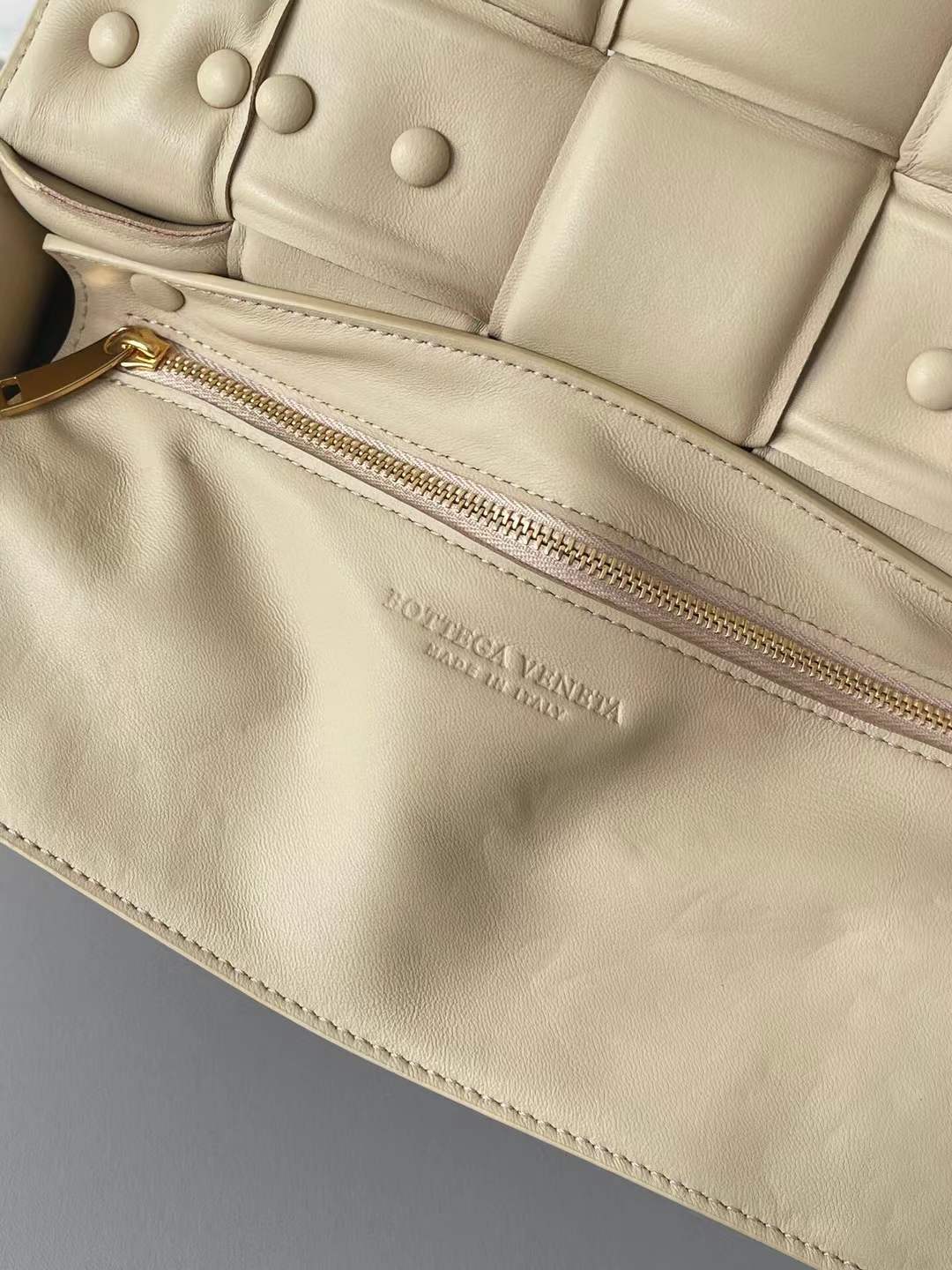 Bottega Veneta Chain Cassette Shoulder Bag in a beige leather with a padded weave and gold chain