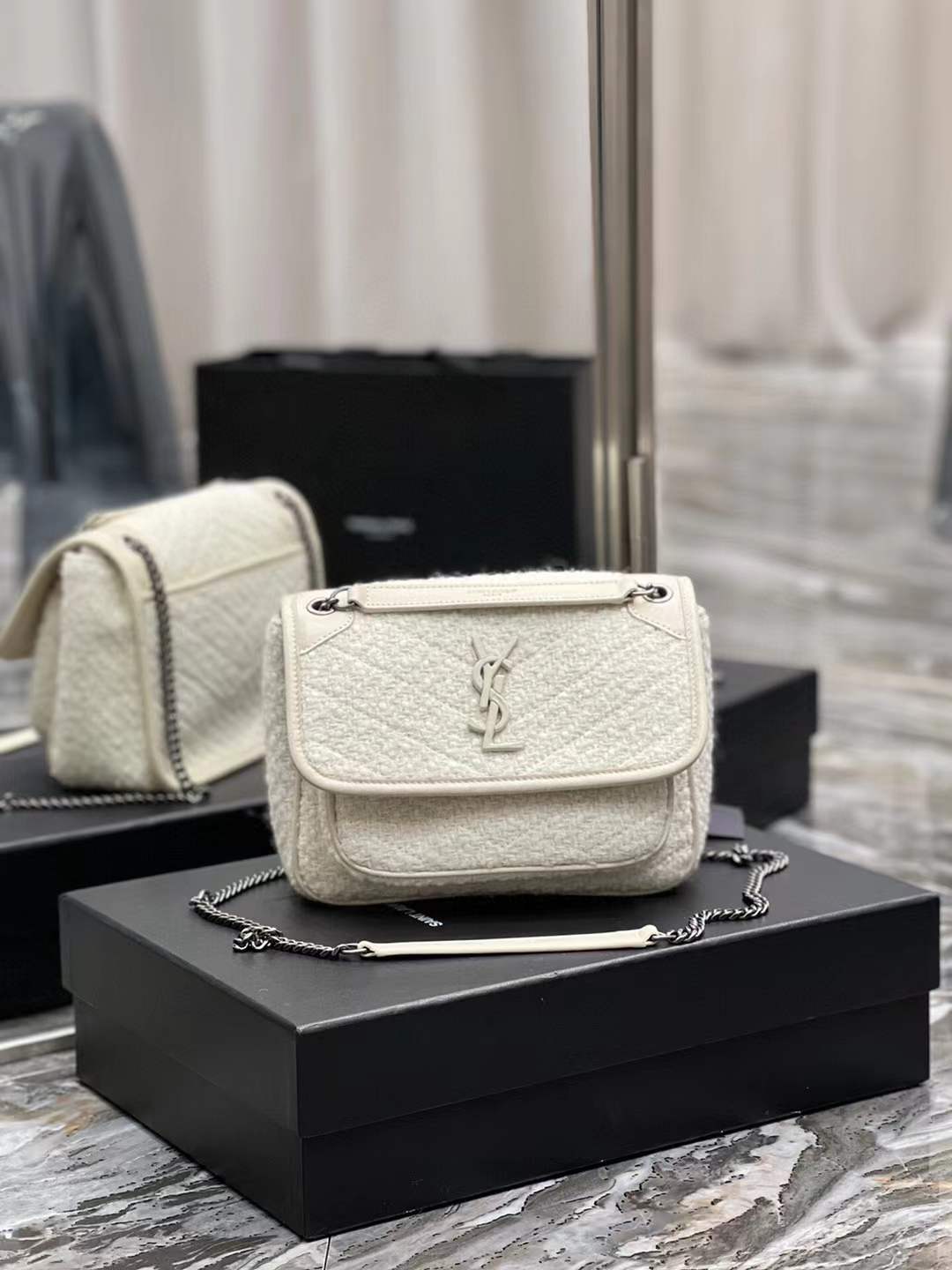 Saint Laurent Niki Baby shoulder bag in white vintage leather
