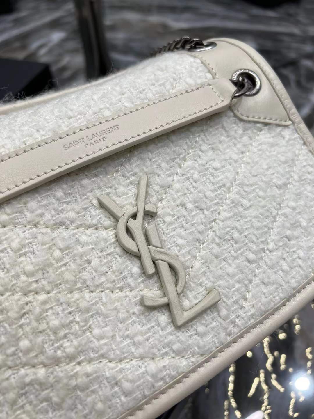 Saint Laurent Niki Baby shoulder bag in white vintage leather
