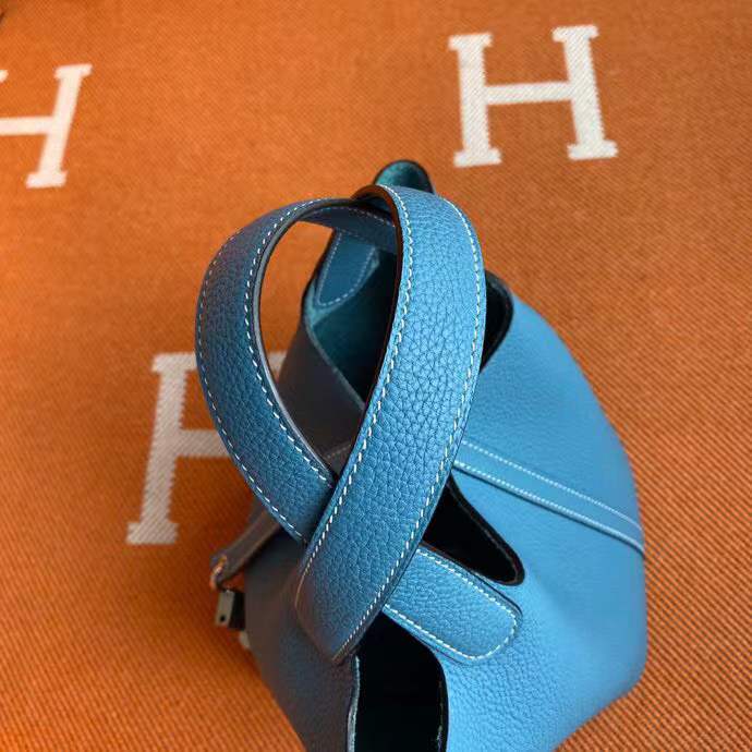Hermès Picotin Lock 18 handbag likely in a blue shade such as New Blue Jean or Bleu Izmir crafted from Taurillon Clemence leather and featuring silver-toned hardware