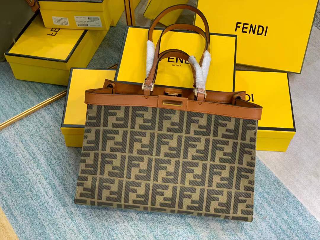 Fendi Peekaboo X-Tote bag features the iconic FF monogram pattern on canvas, brown leather trim, and gold-tone hardware