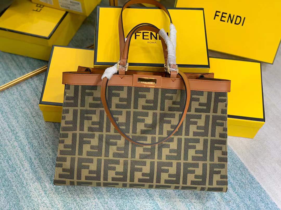Fendi Peekaboo X-Tote bag features the iconic FF monogram pattern on canvas, brown leather trim, and gold-tone hardware