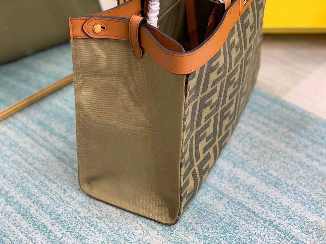 Fendi Peekaboo X-Tote bag features the iconic FF monogram pattern on canvas, brown leather trim, and gold-tone hardware