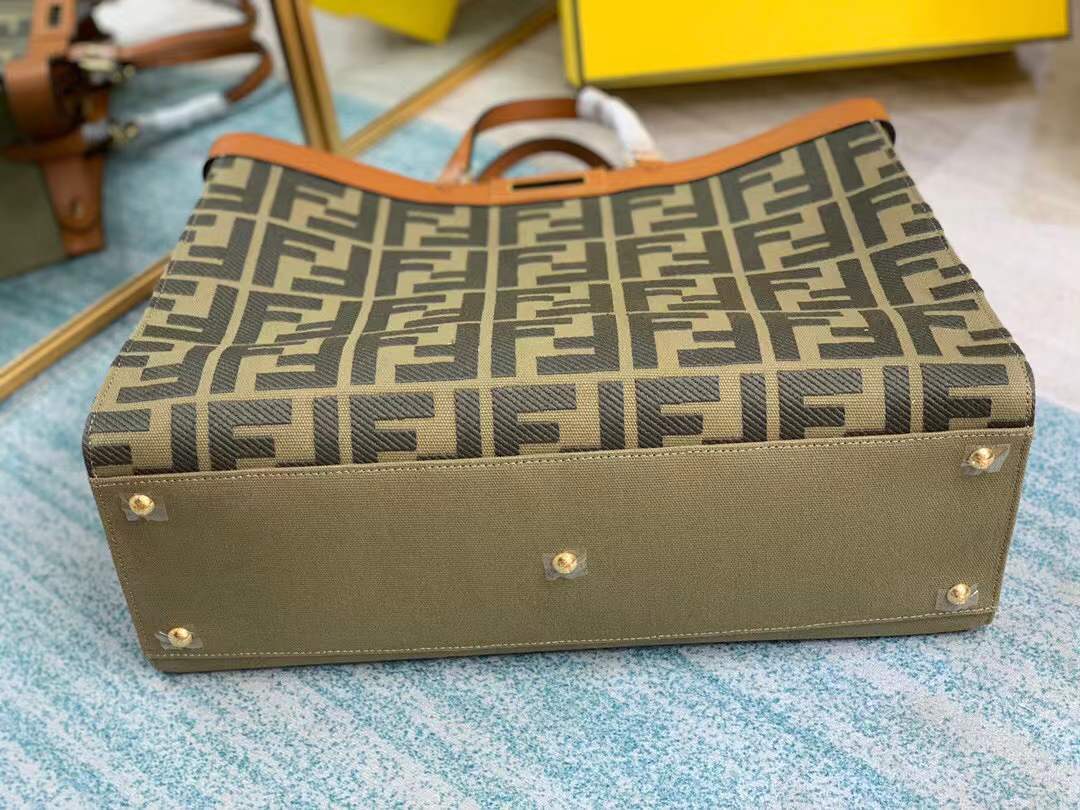 Fendi Peekaboo X-Tote bag features the iconic FF monogram pattern on canvas, brown leather trim, and gold-tone hardware