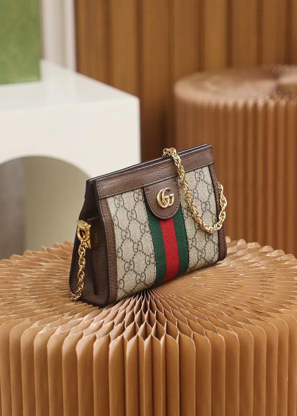 Gucci Small Ophidia shoulder bag featuring the iconic GG Supreme canvas and signature Web stripe
