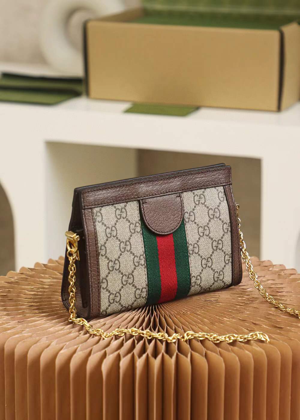 Gucci Small Ophidia shoulder bag featuring the iconic GG Supreme canvas and signature Web stripe