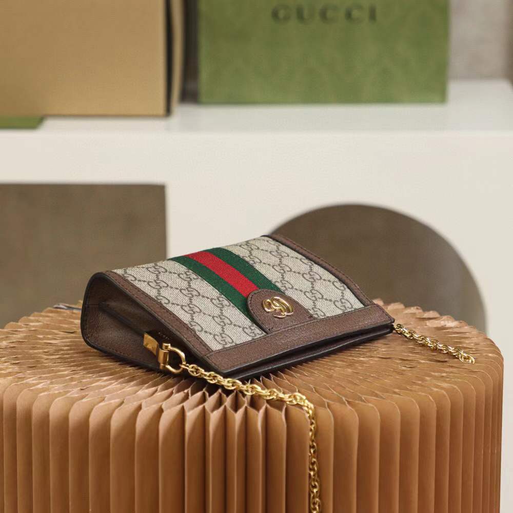 Gucci Small Ophidia shoulder bag featuring the iconic GG Supreme canvas and signature Web stripe