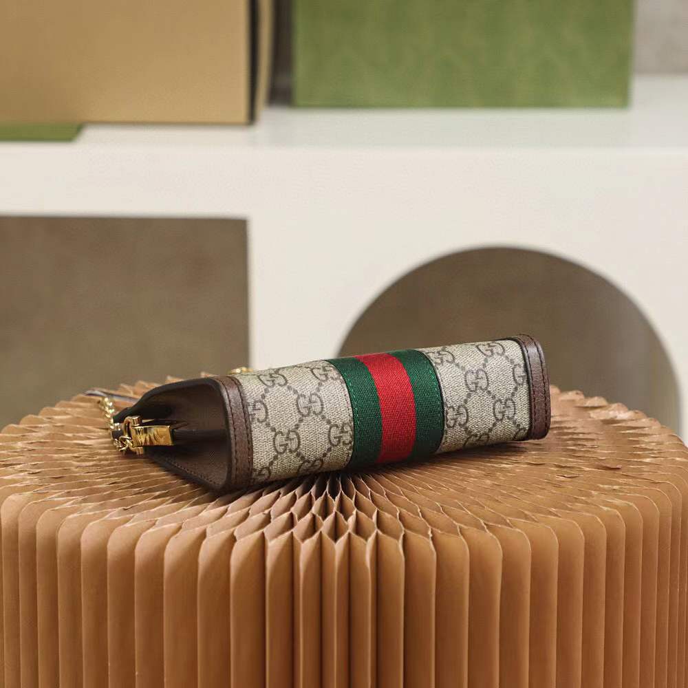 Gucci Small Ophidia shoulder bag featuring the iconic GG Supreme canvas and signature Web stripe