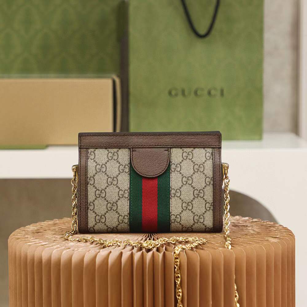 Gucci Small Ophidia shoulder bag featuring the iconic GG Supreme canvas and signature Web stripe