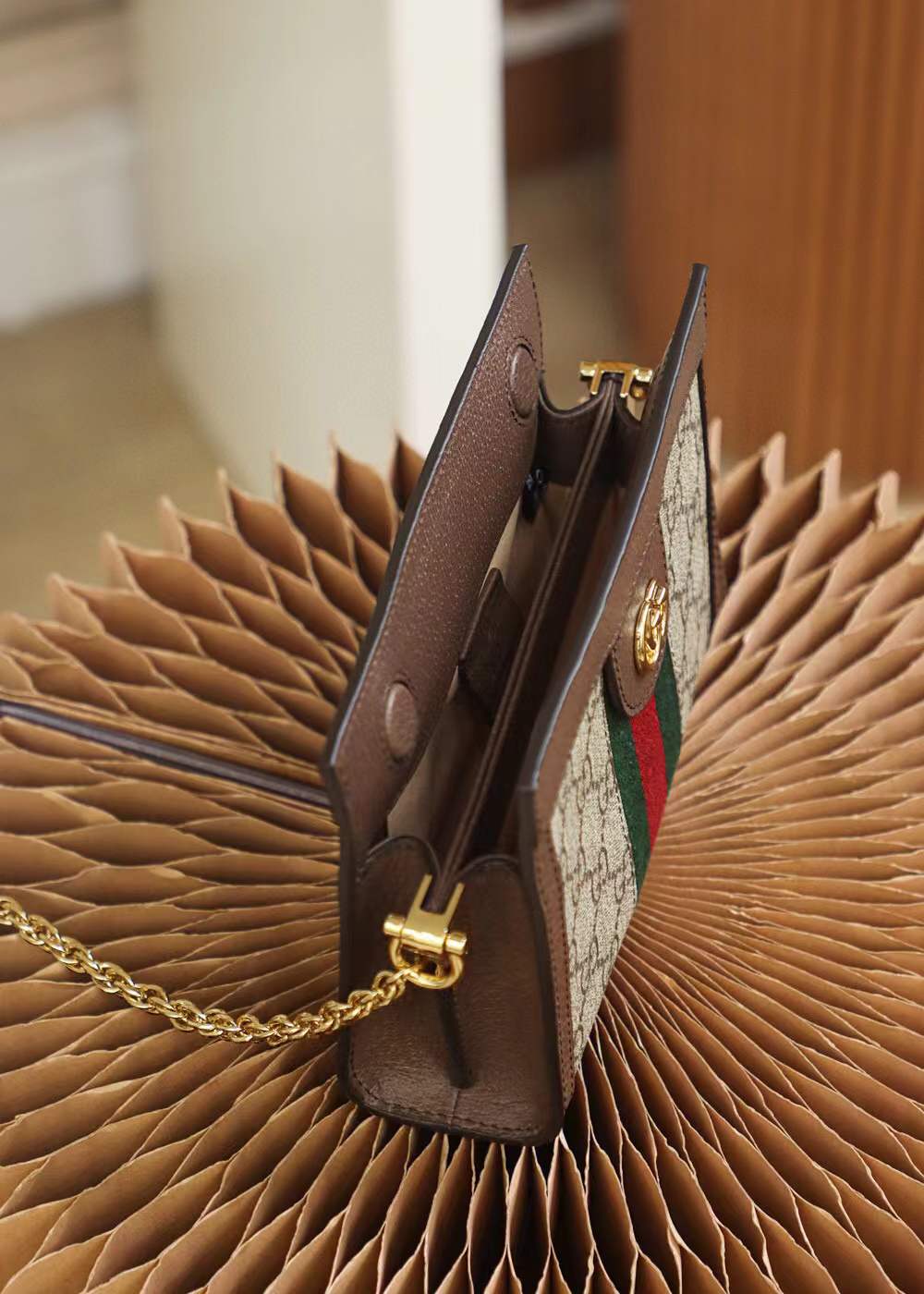 Gucci Small Ophidia shoulder bag featuring the iconic GG Supreme canvas and signature Web stripe