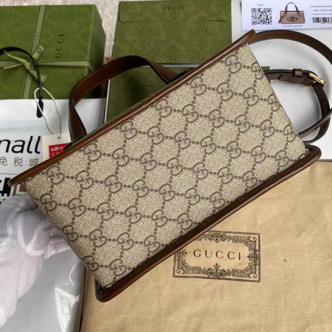 Gucci Horsebit 1955 Mini Top Handle Bag crafted from the brand's signature supreme canvas with brown leather trim