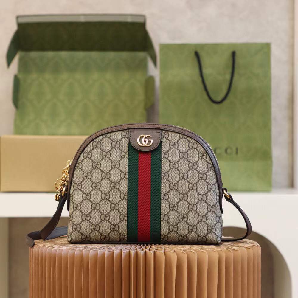 Gucci Ophidia Small GG Supreme Shoulder Bag, a dome-shaped canvas bag featuring the iconic green and red Web stripe and golden Double G hardware