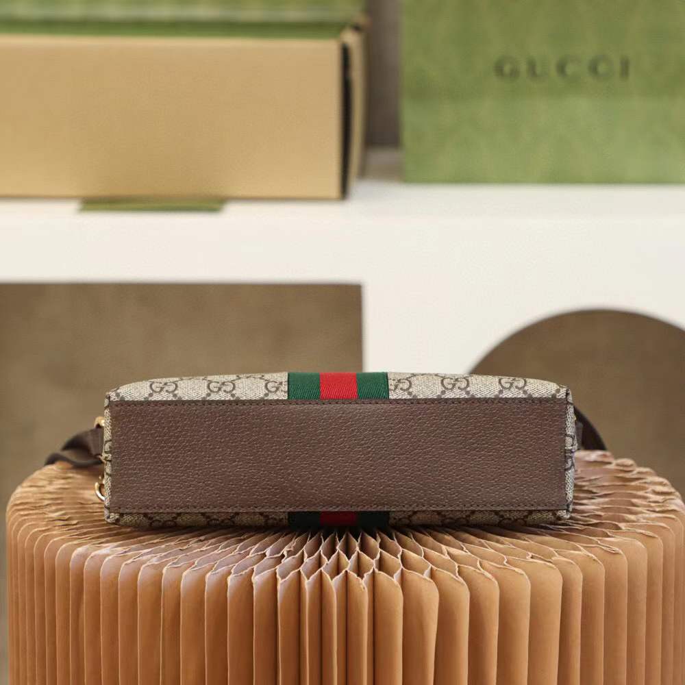 Gucci Ophidia Small GG Supreme Shoulder Bag, a dome-shaped canvas bag featuring the iconic green and red Web stripe and golden Double G hardware