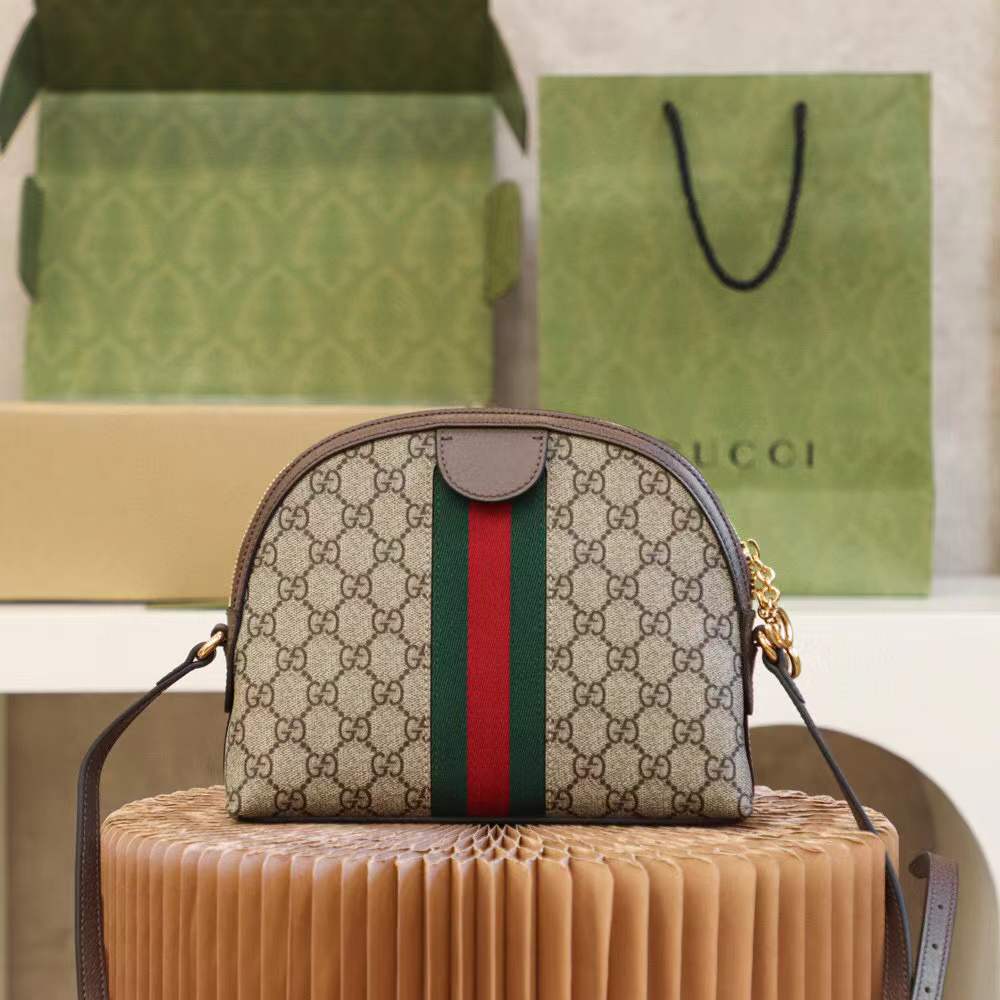 Gucci Ophidia Small GG Supreme Shoulder Bag, a dome-shaped canvas bag featuring the iconic green and red Web stripe and golden Double G hardware