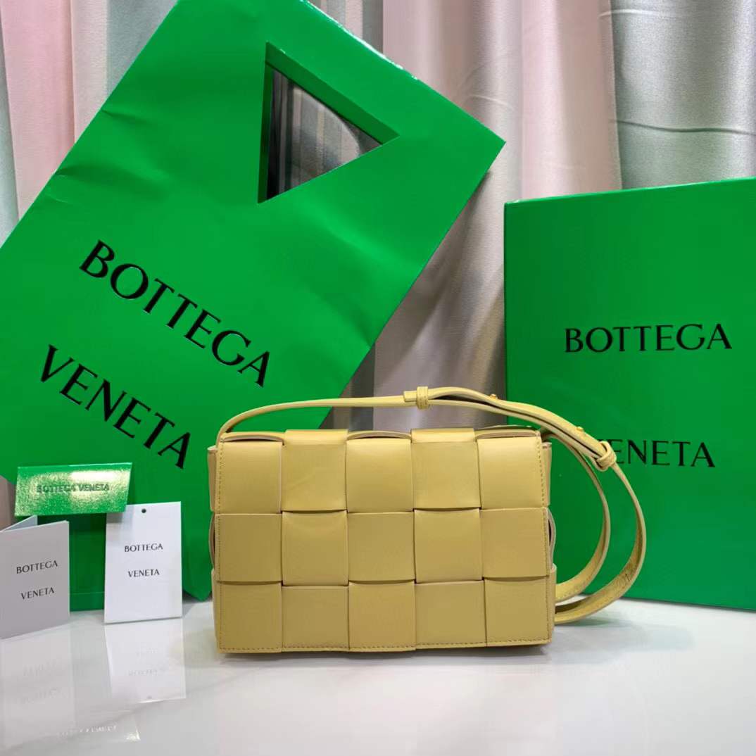 Bottega Veneta Cassette leather shoulder bag in a lemon yellow color