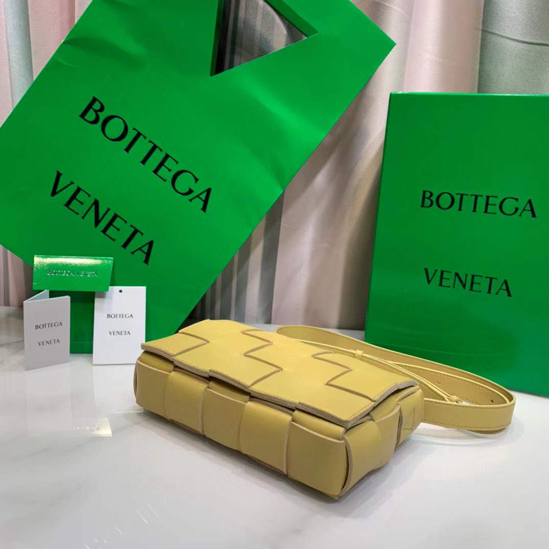 Bottega Veneta Cassette leather shoulder bag in a lemon yellow color