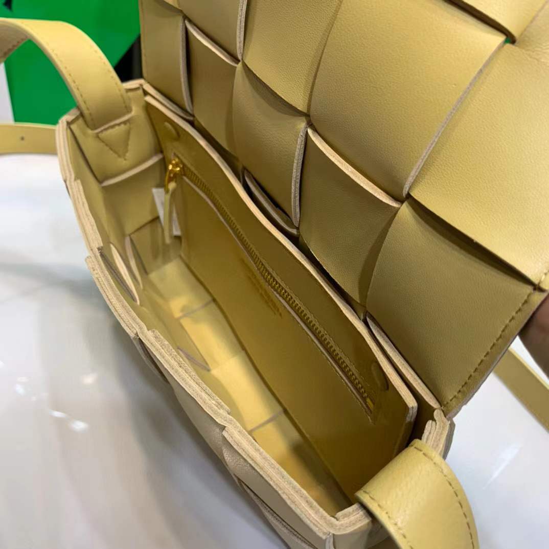 Bottega Veneta Cassette leather shoulder bag in a lemon yellow color