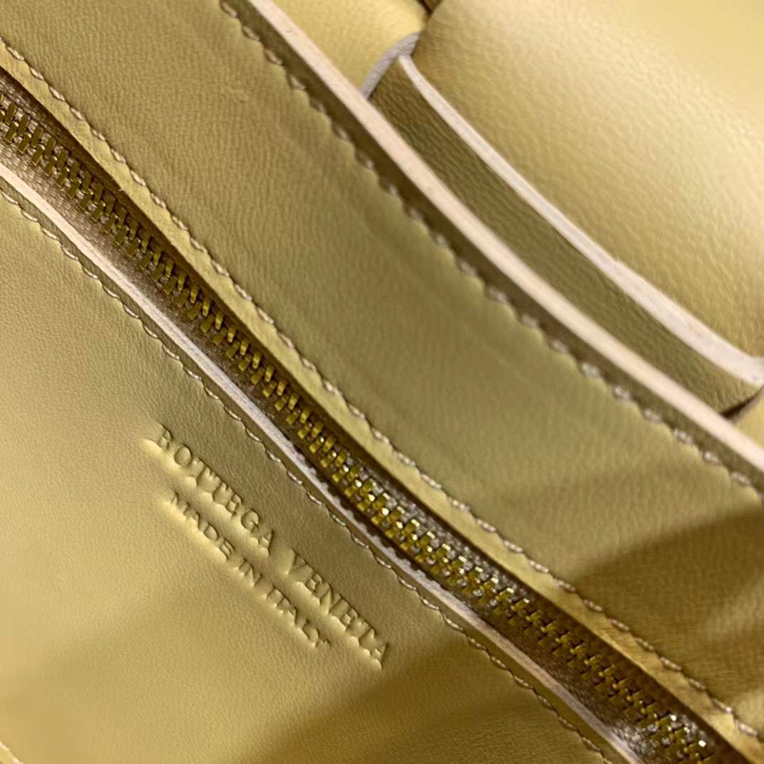 Bottega Veneta Cassette leather shoulder bag in a lemon yellow color