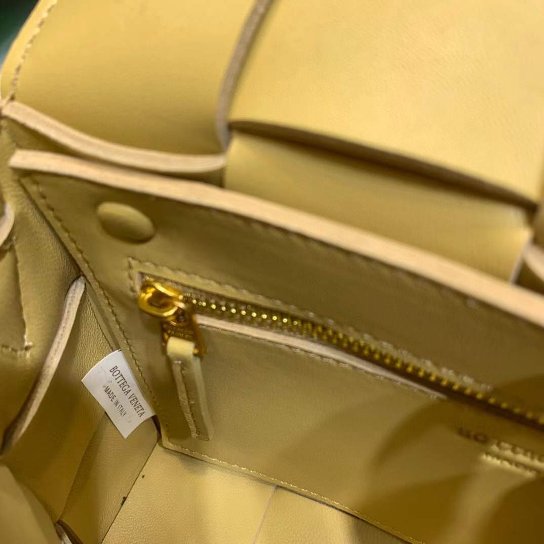 Bottega Veneta Cassette leather shoulder bag in a lemon yellow color