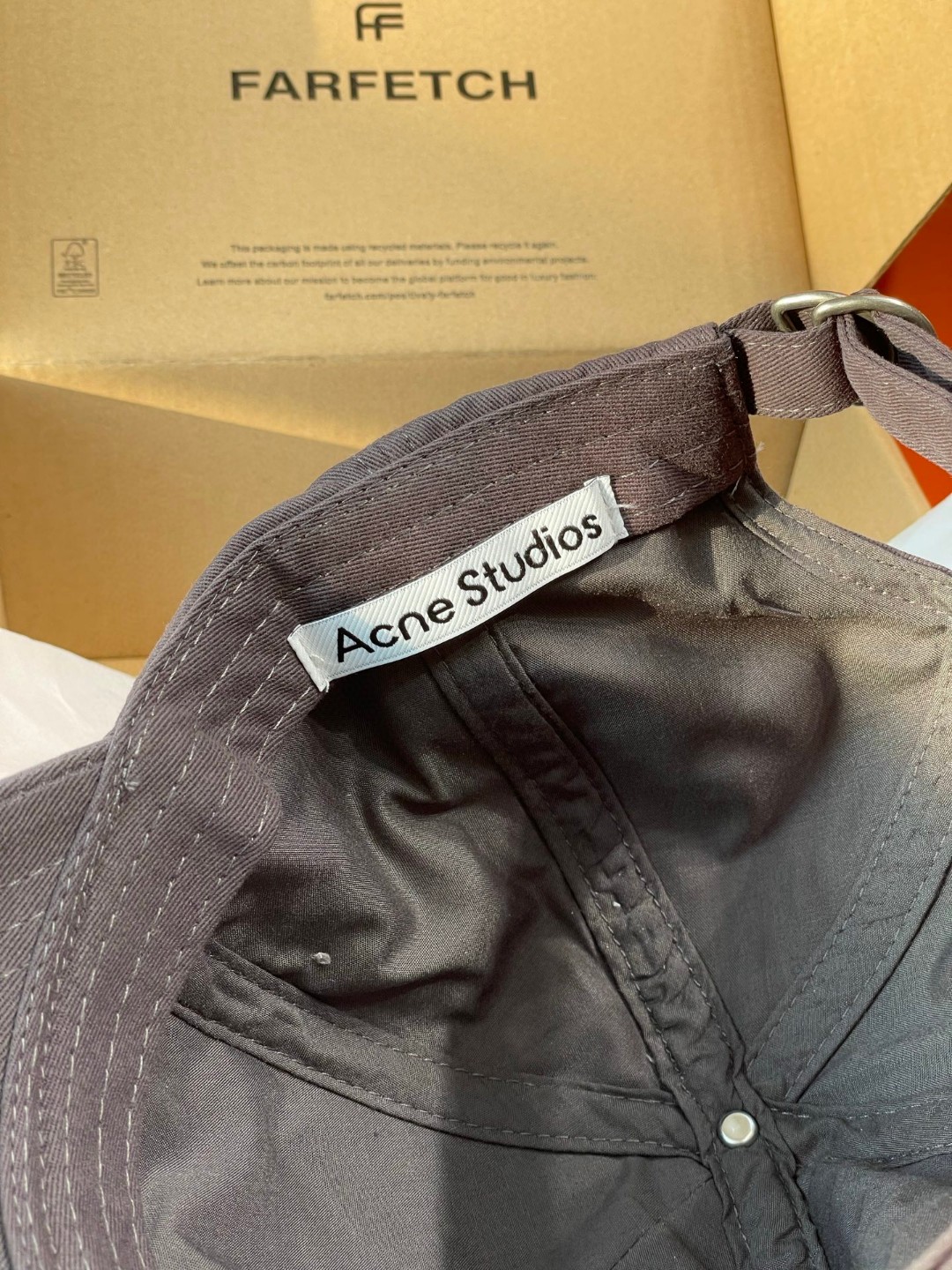 Acne Studios Stockholm 1996 cap in faded black crafted from washed cotton twill with an embroidered logo on the front panel