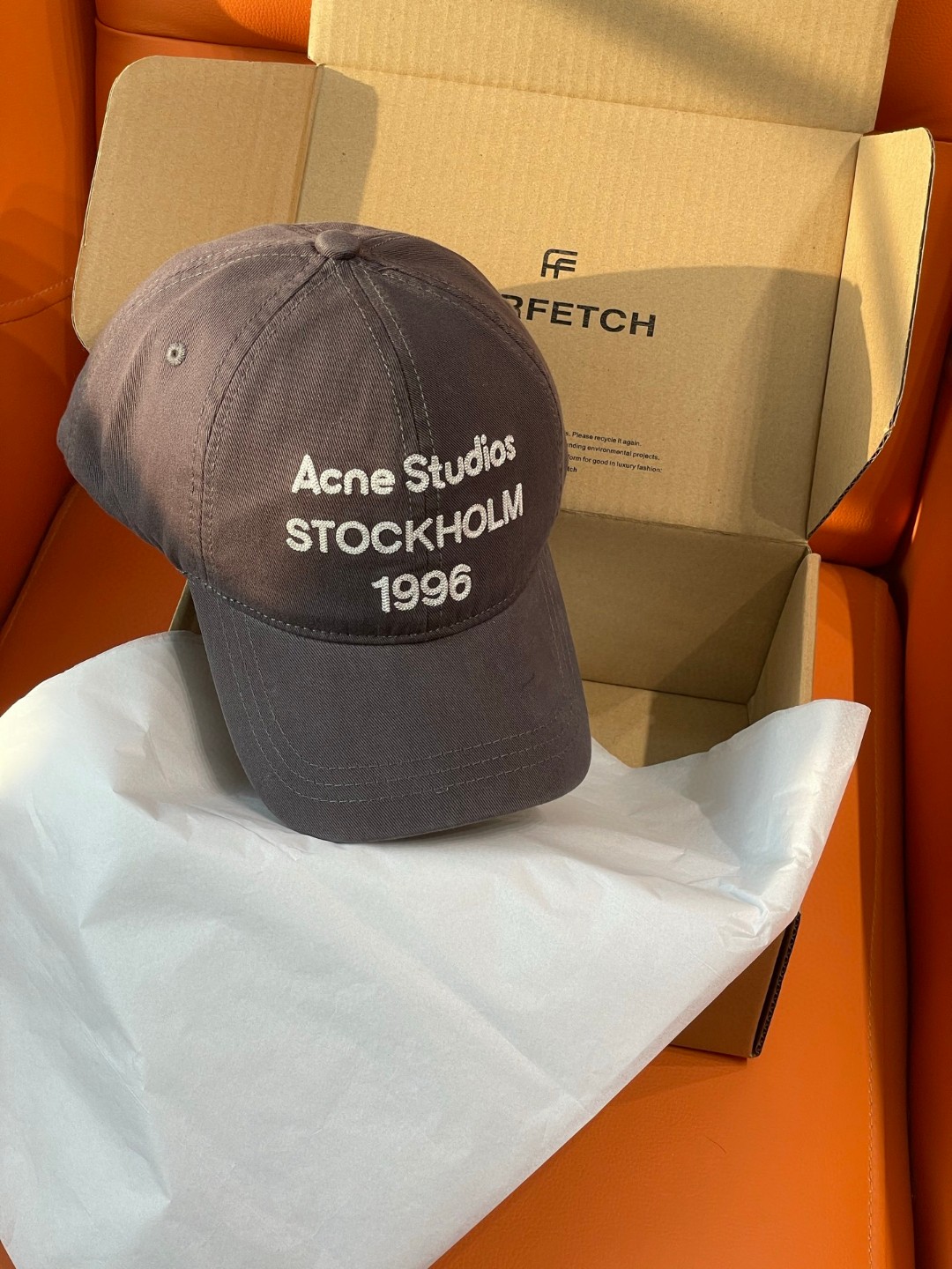 Acne Studios Stockholm 1996 cap in faded black crafted from washed cotton twill with an embroidered logo on the front panel
