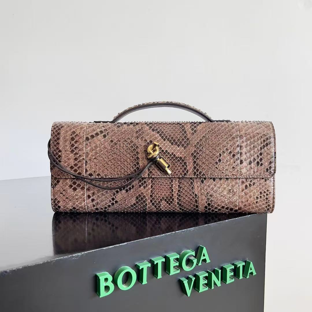 Bottega Veneta Andiamo clutch in python leather featuring a signature gold-tone knot closure