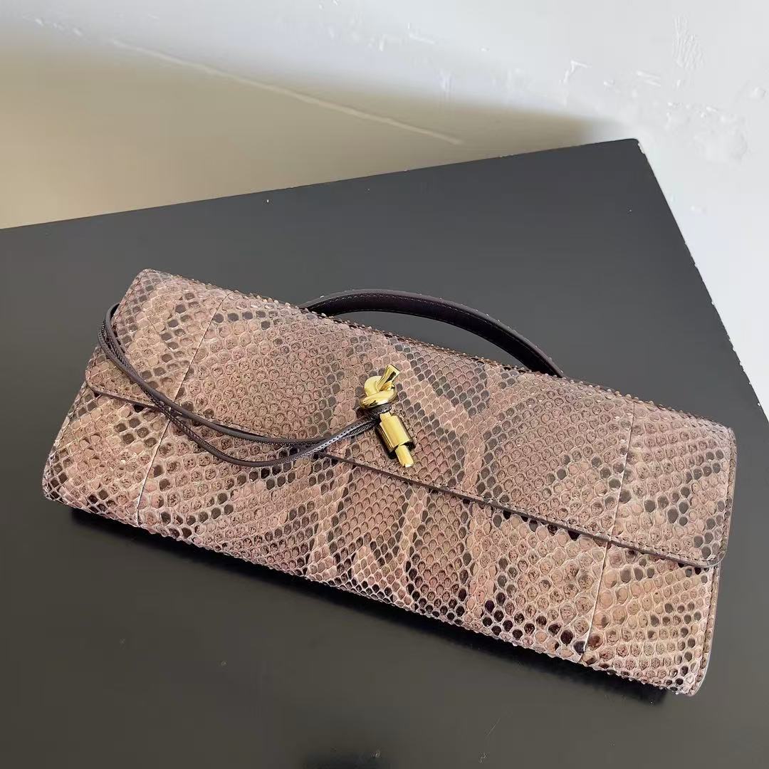 Bottega Veneta Andiamo clutch in python leather featuring a signature gold-tone knot closure