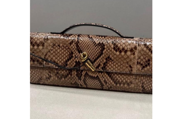 Bottega Veneta Andiamo clutch in python leather featuring a signature gold-tone knot closure