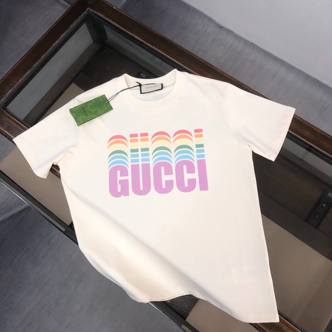 Gucci white T-shirt features a colorful, retro-inspired rainbow logo graphic