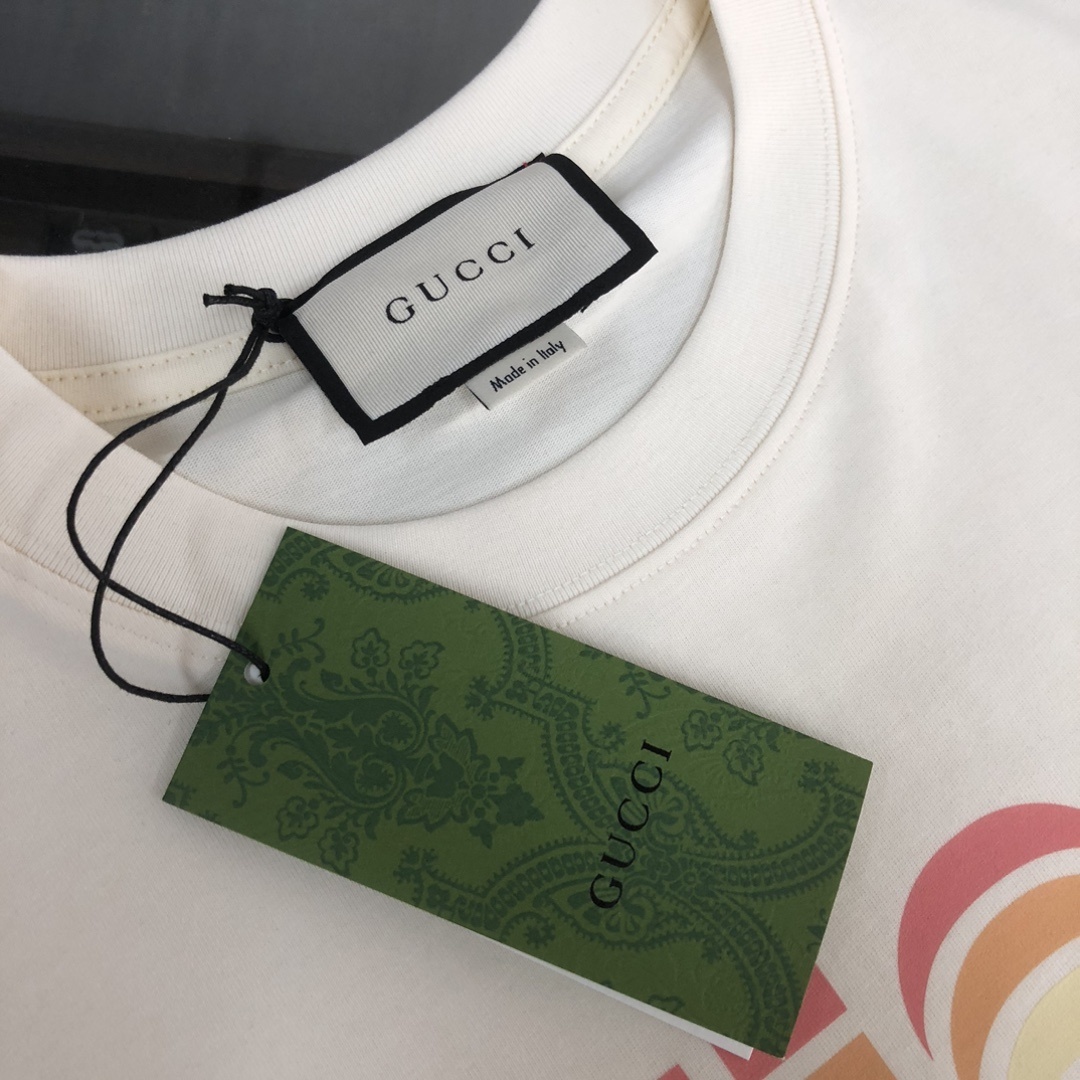 Gucci white T-shirt features a colorful, retro-inspired rainbow logo graphic
